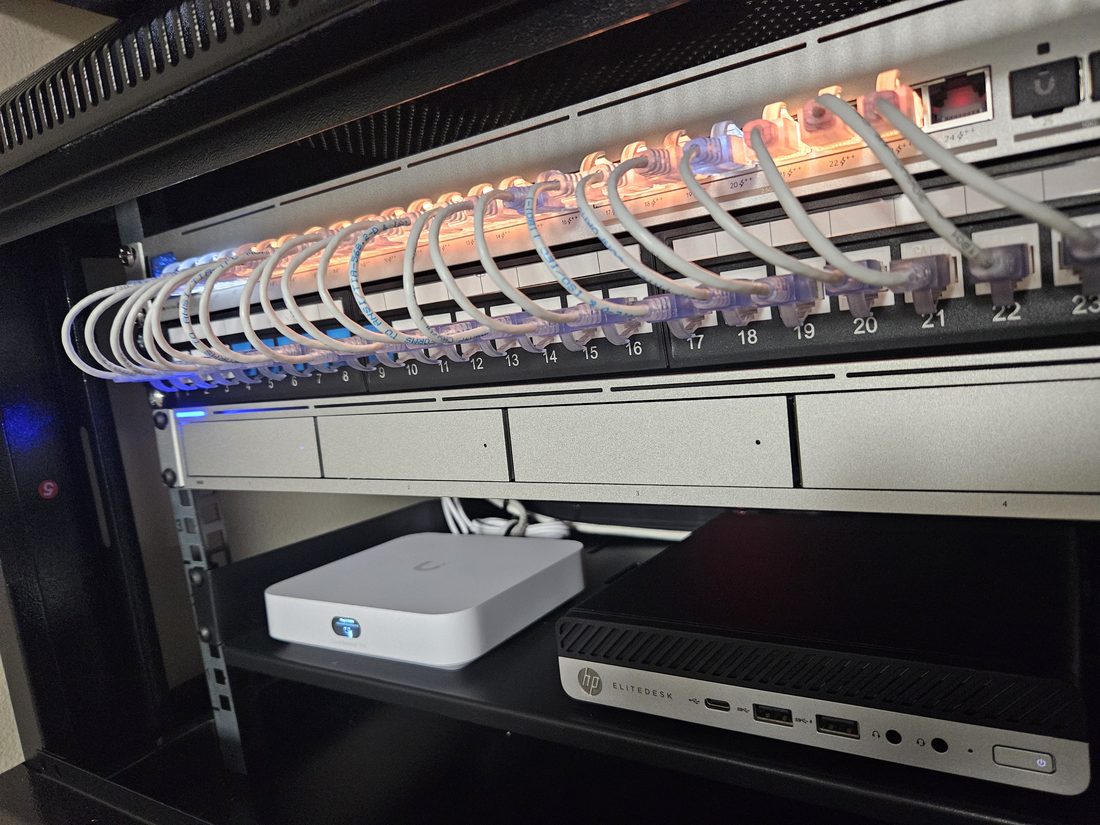 Structured cabling and patch panel in a UniFi network rack installed by London Tech Solutions